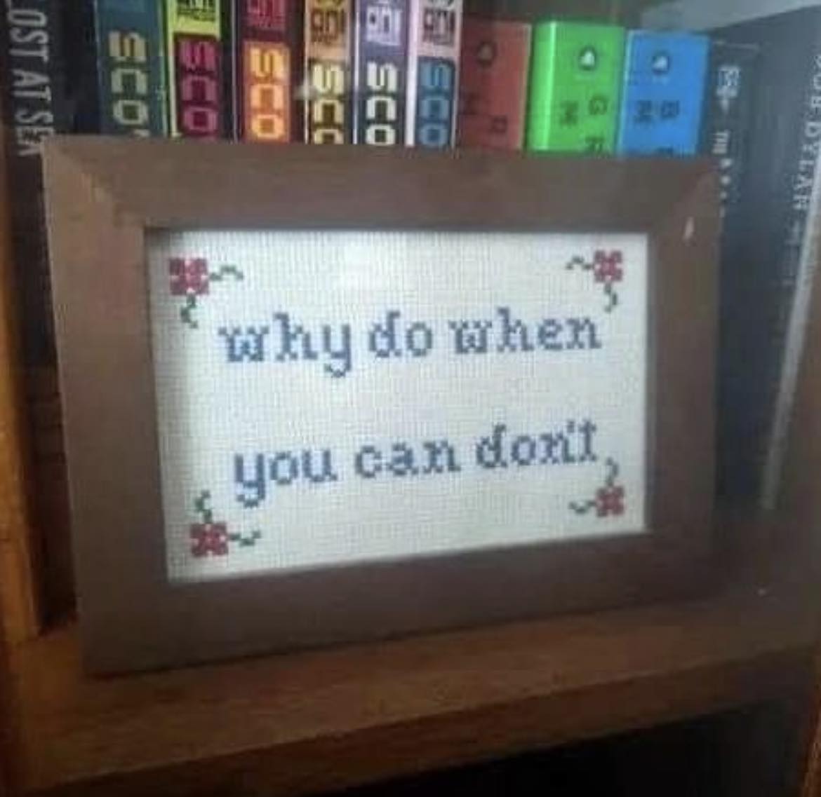 The meme is a photo of a cross-stitched picture with the phrase "Why do I exist? Why am I here? Because this is where I am meant to be. Because I am here. Because this is where I am. Because this is where I am." However, the text is intentionally misspelled and says "Why do I exsist? Why am I here? Because this is where I am ment to be. Because I am here. Because this is where I am. Because this is where I am." The image is humorous because it is a poorly written and grammatically incorrect version of a famous philosophical quote by Albert Camus.